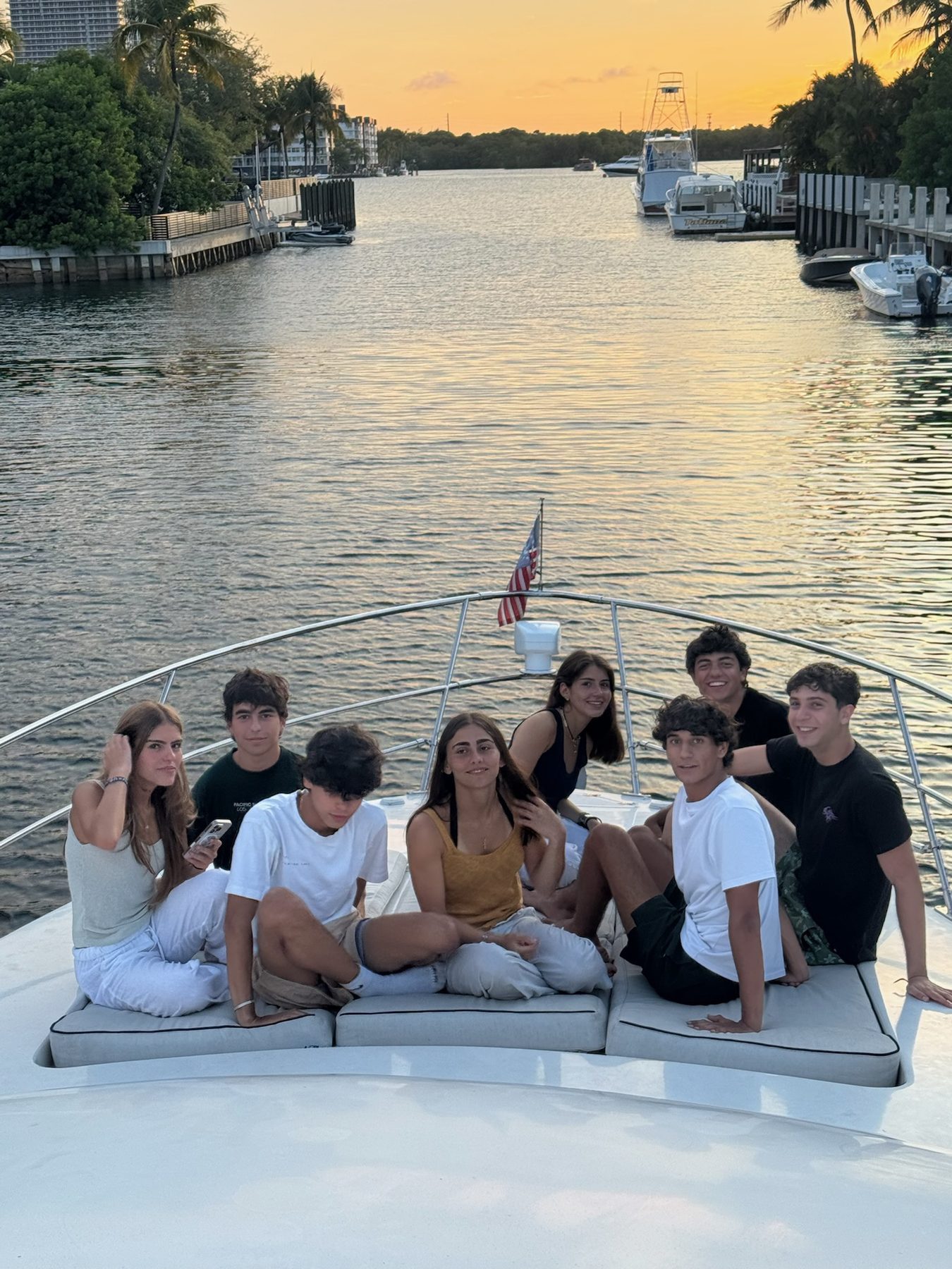 Friends on the bow at sunset